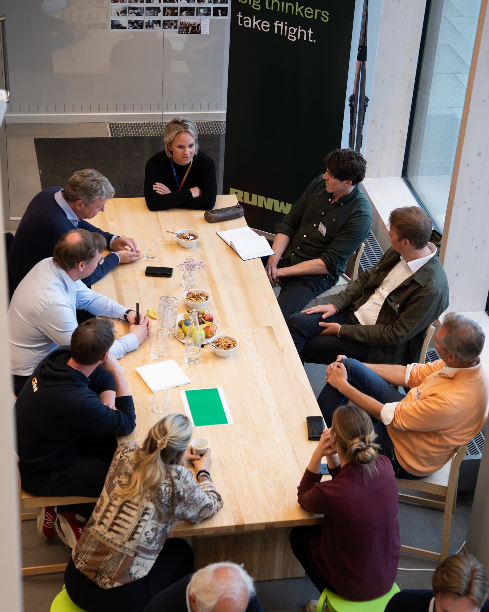 Roundtable discussion under the Big Thinkers Take Flight wall at Fast Track Days 2024