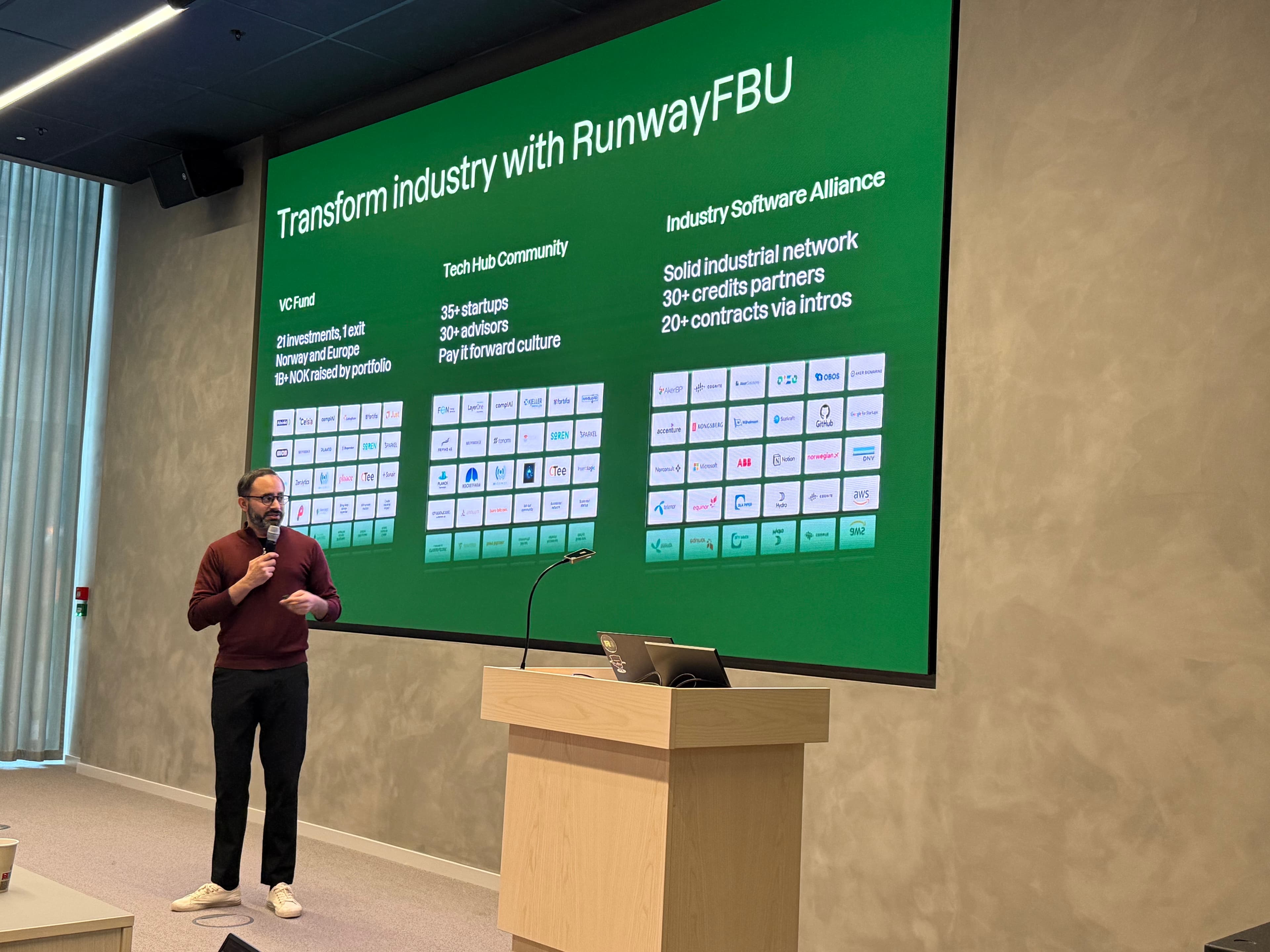 Speaker presenting the RunwayFBU ecosystem: VC Fund, Tech Hub Community and Industry Software Alliance