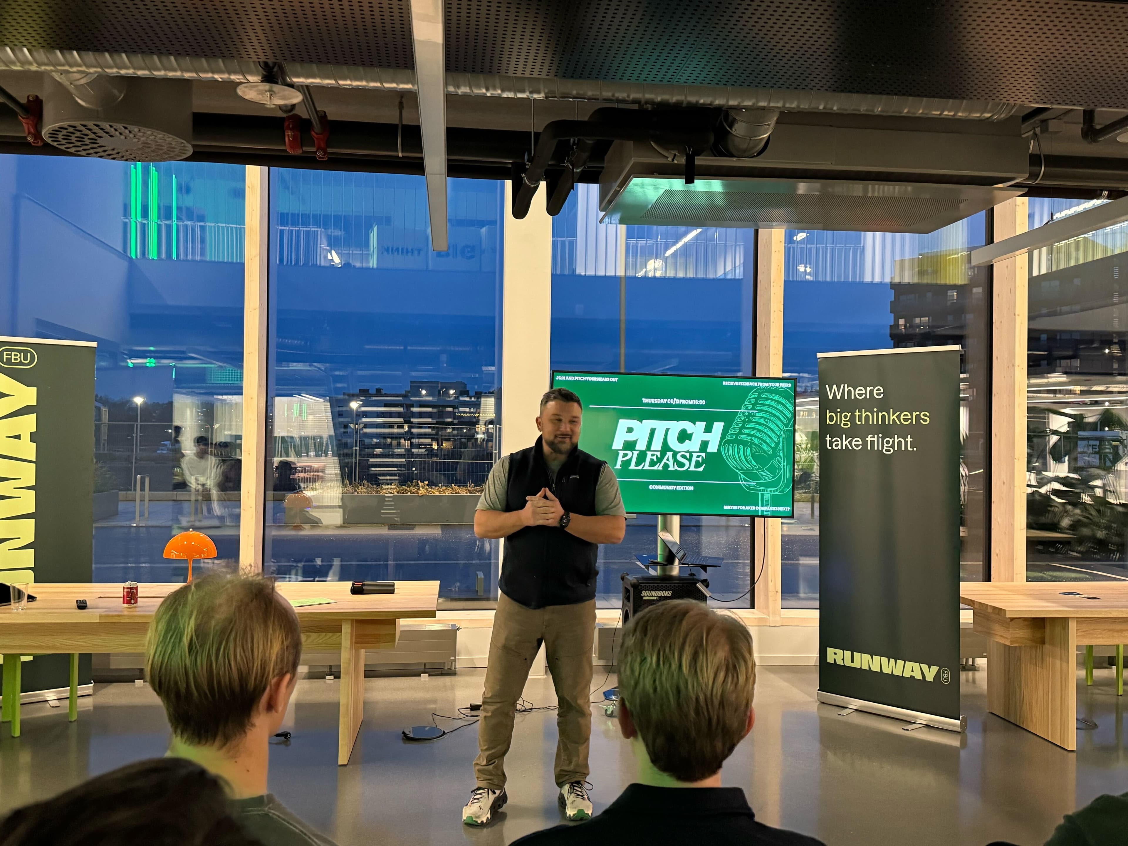 Founder delivering a Pitch Please pitch night at the Tech Hub