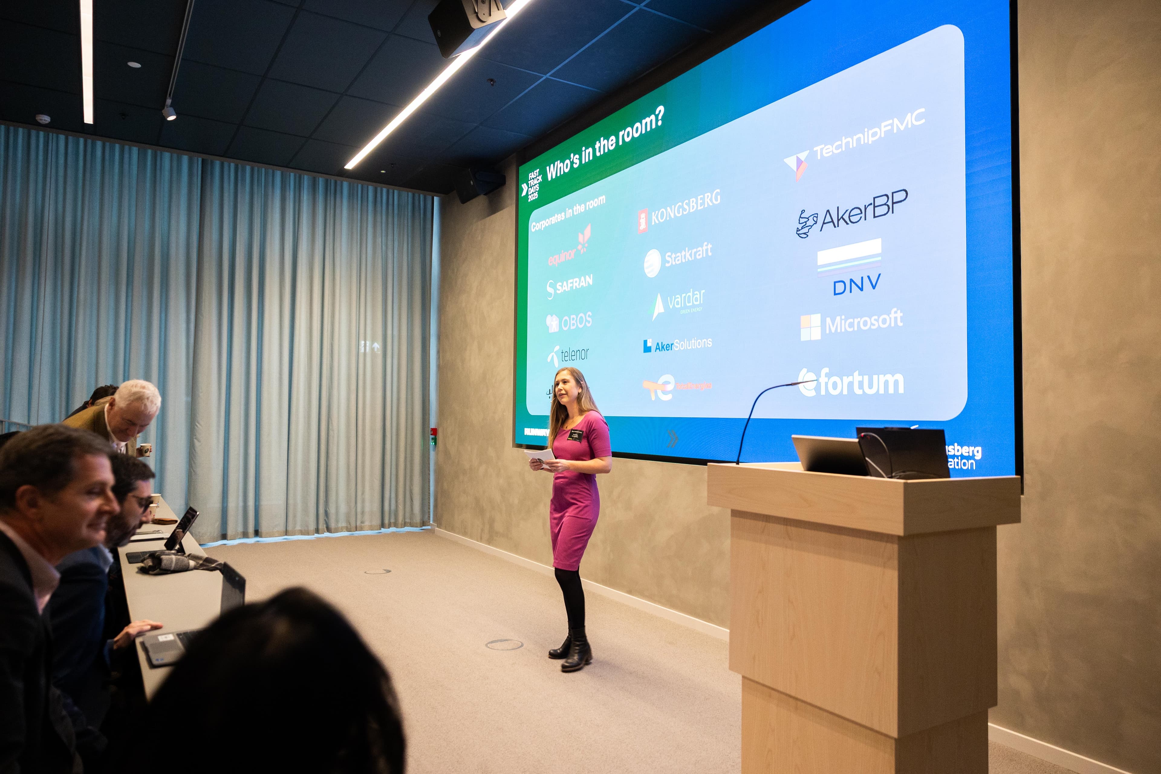 Industry partners showcase slide on stage at a Lab session