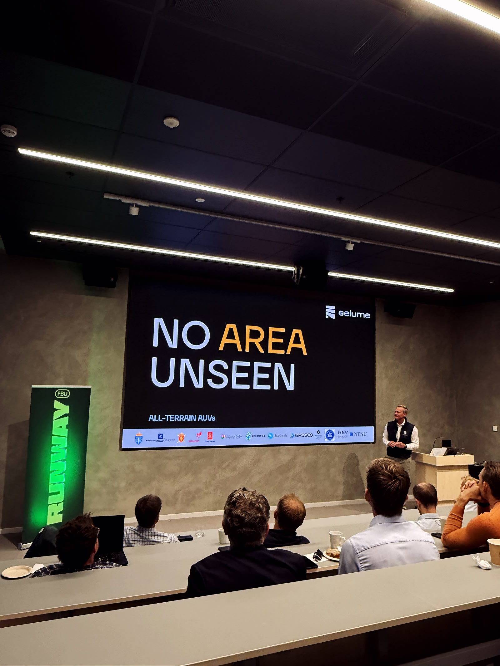 Thomas Nygård, CEO of Eelume, presenting the ‘No area unseen’ all-terrain AUV closing slide.